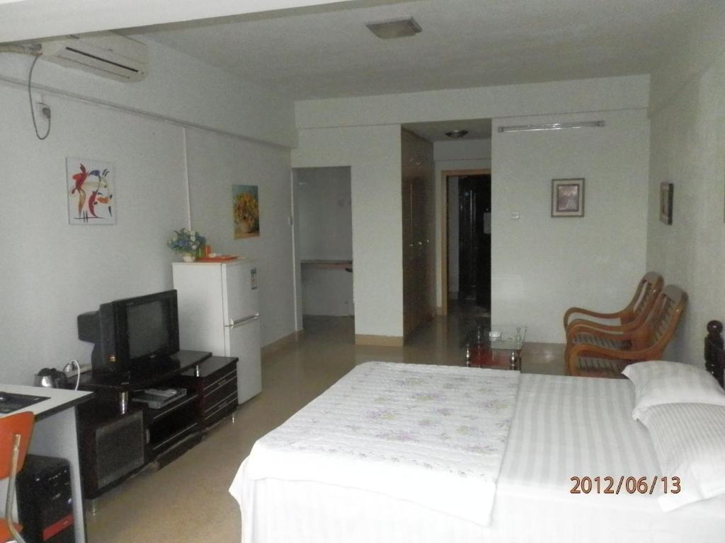 Xingfu Hotel Nanning Værelse billede