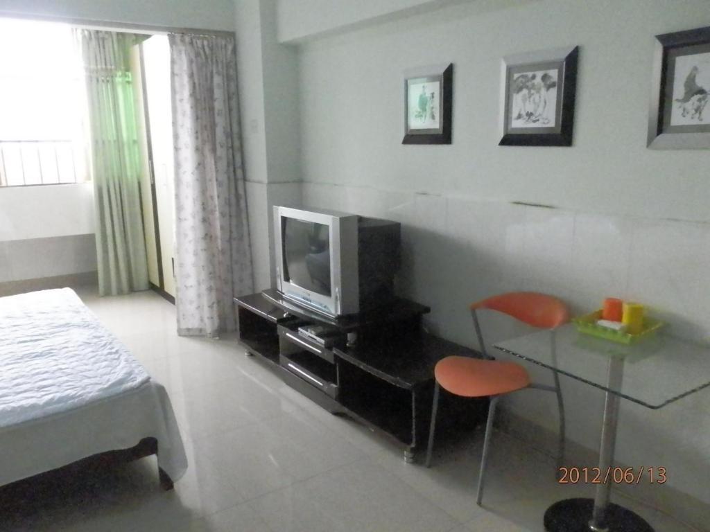 Xingfu Hotel Nanning Værelse billede