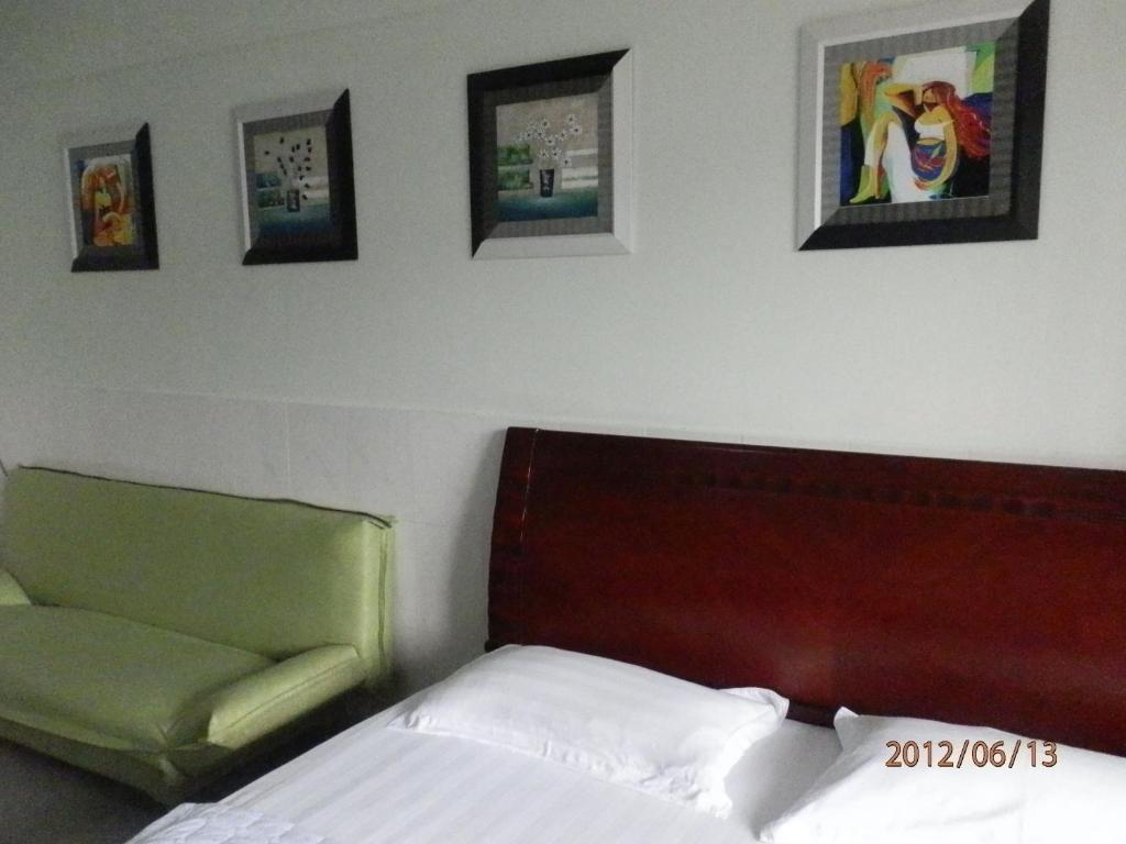 Xingfu Hotel Nanning Værelse billede