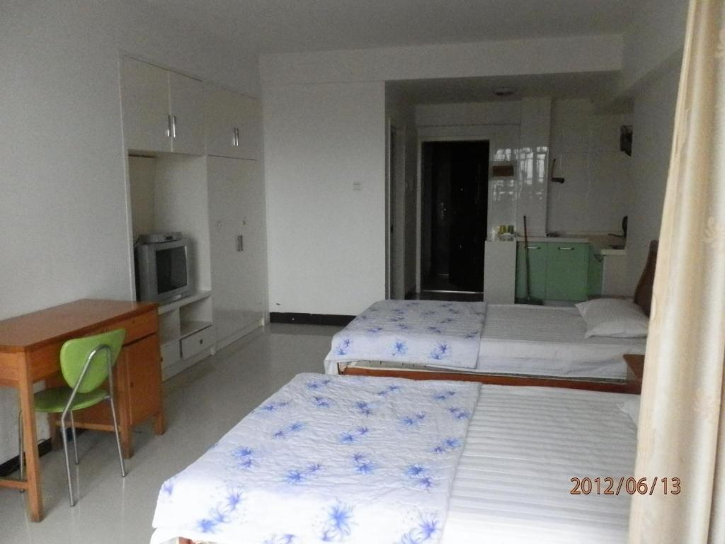 Xingfu Hotel Nanning Værelse billede