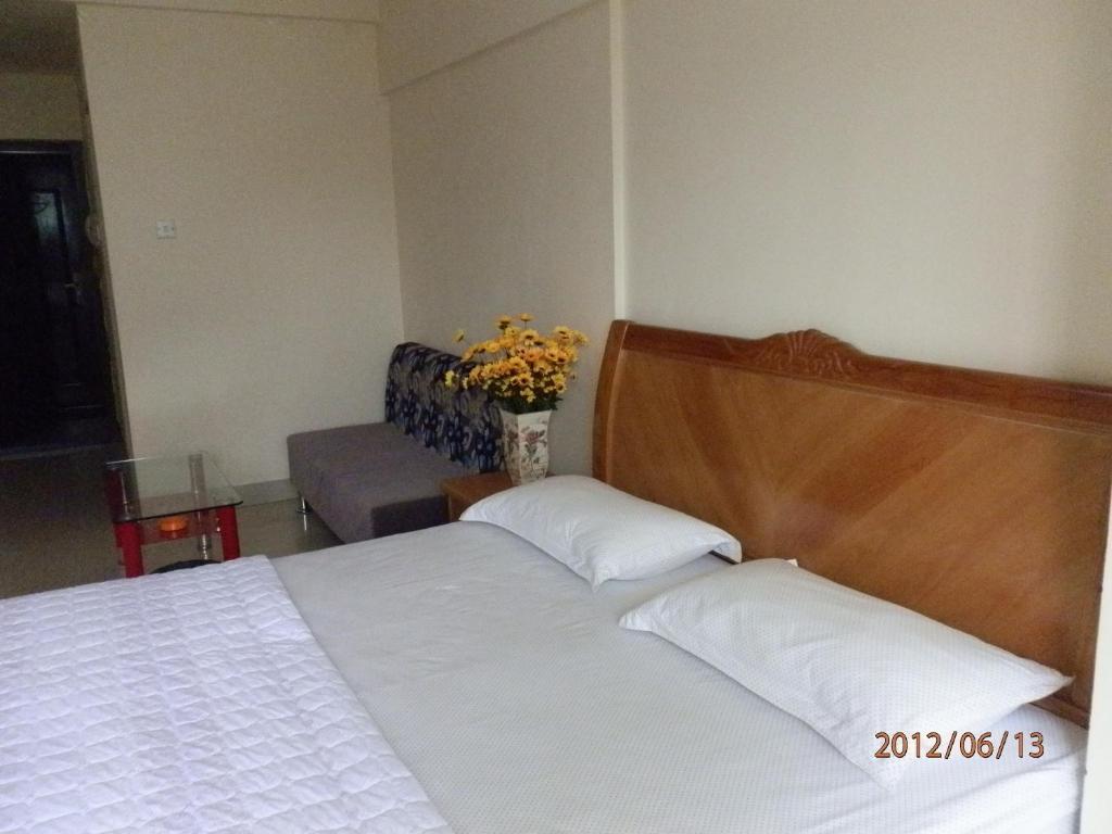 Xingfu Hotel Nanning Værelse billede